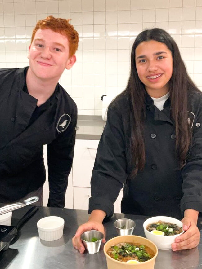 Two teenagers cooking at LKA