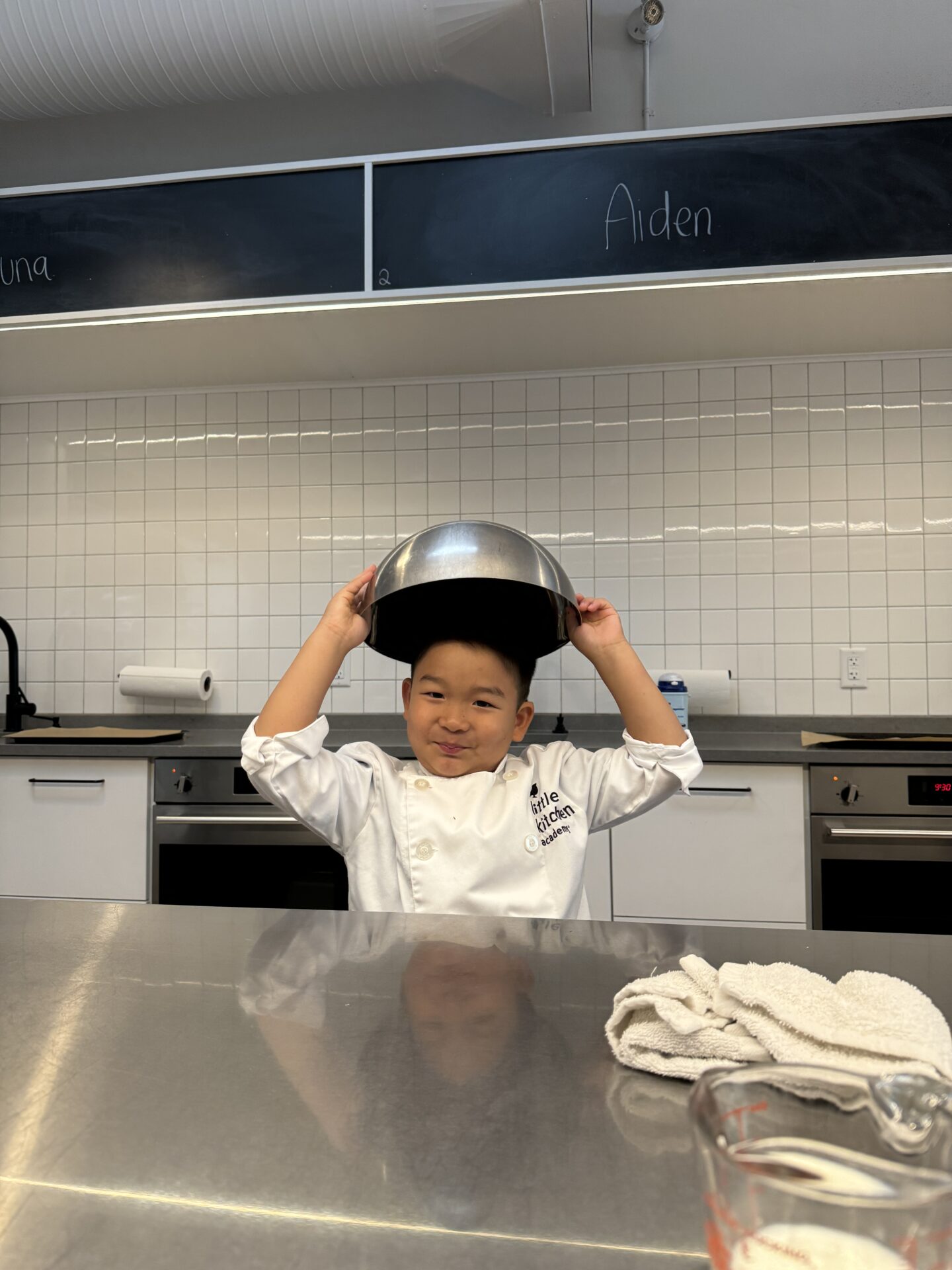 LKA student playfully wearing bowl as hat