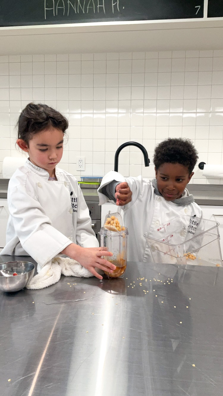 LKA students helping each other measure ingredients