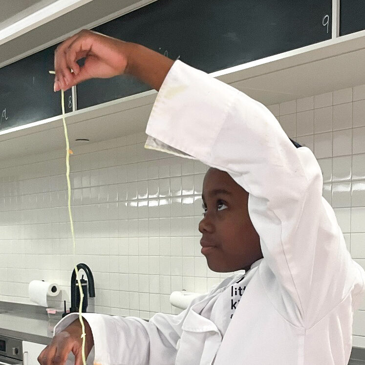 LKA student holding spiralized zucchini