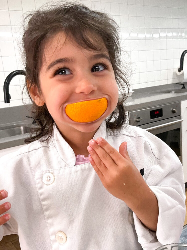 LKA student smiling with an orange