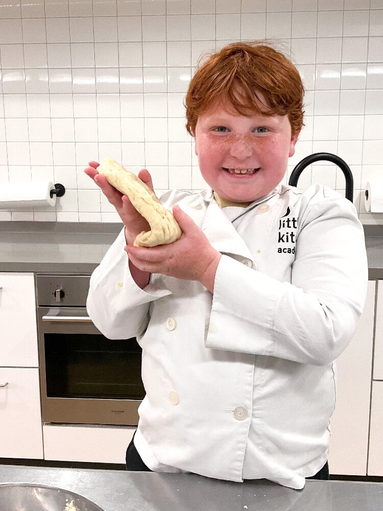 LKA student holding up food in class