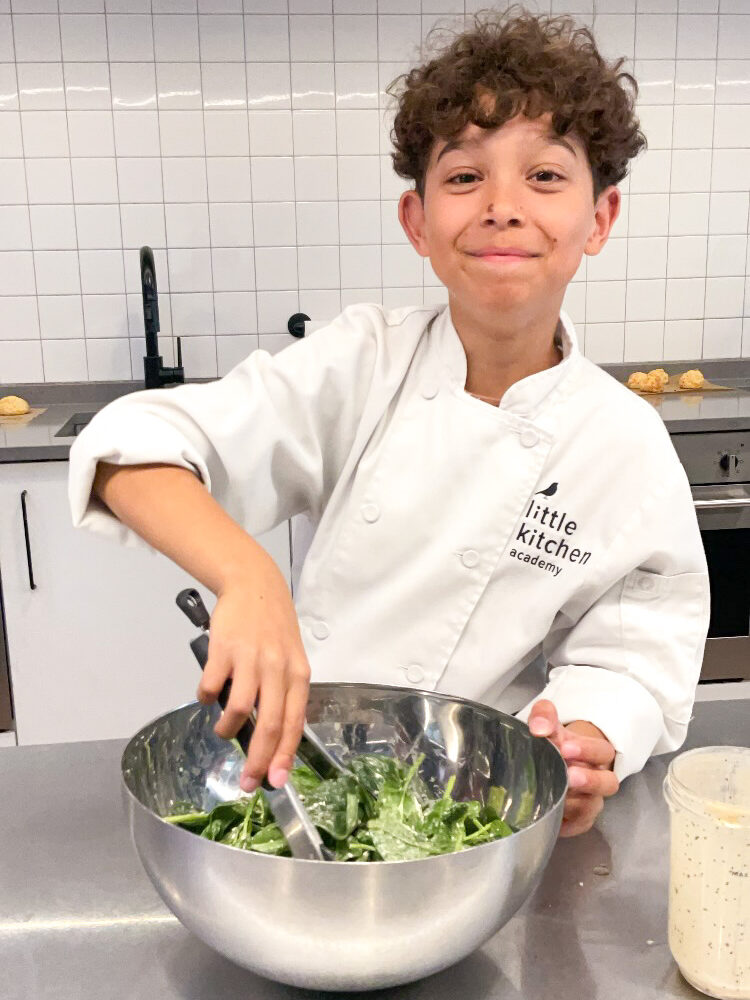 LKA student mixing salad in bowl