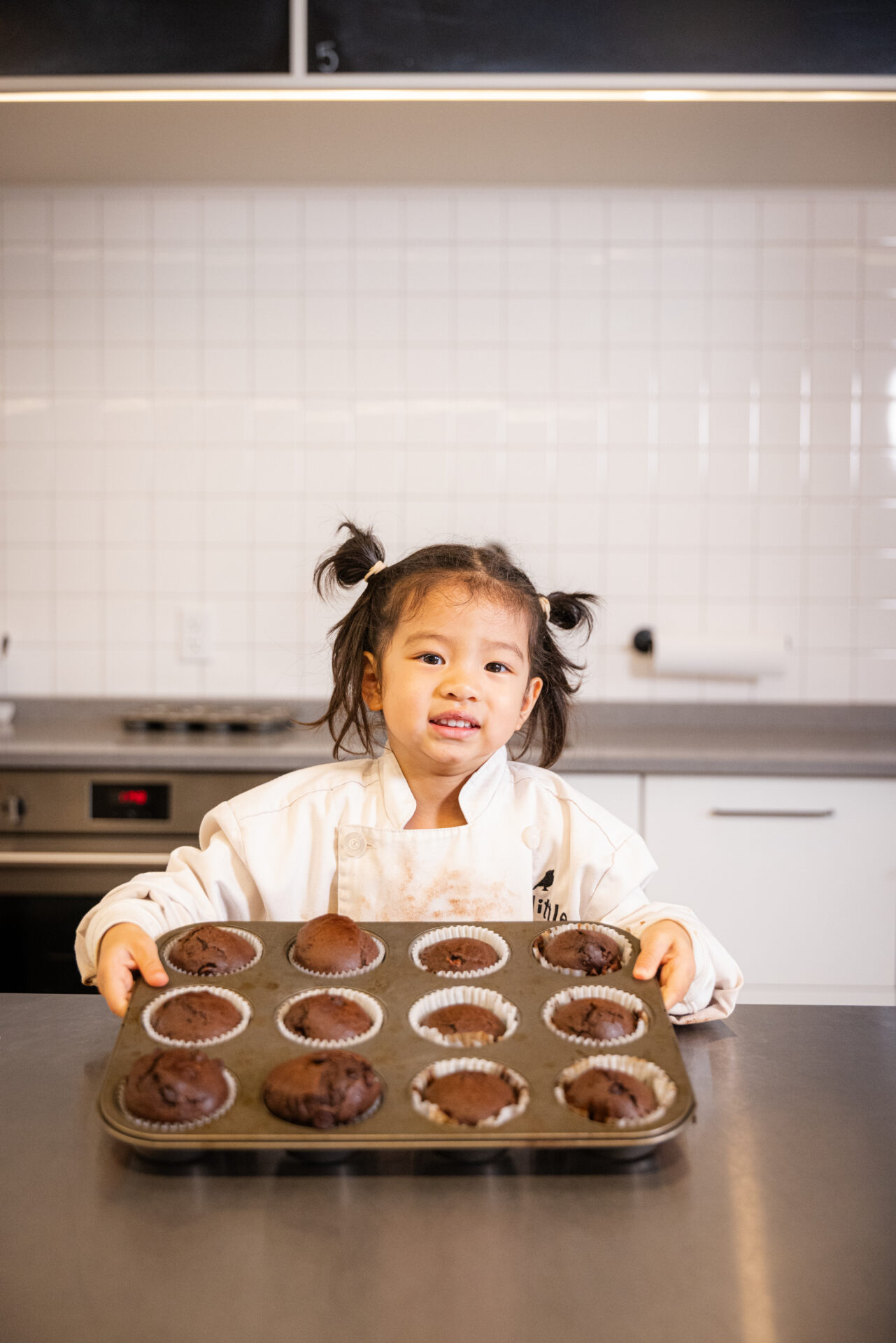 Student posting with cupcakes