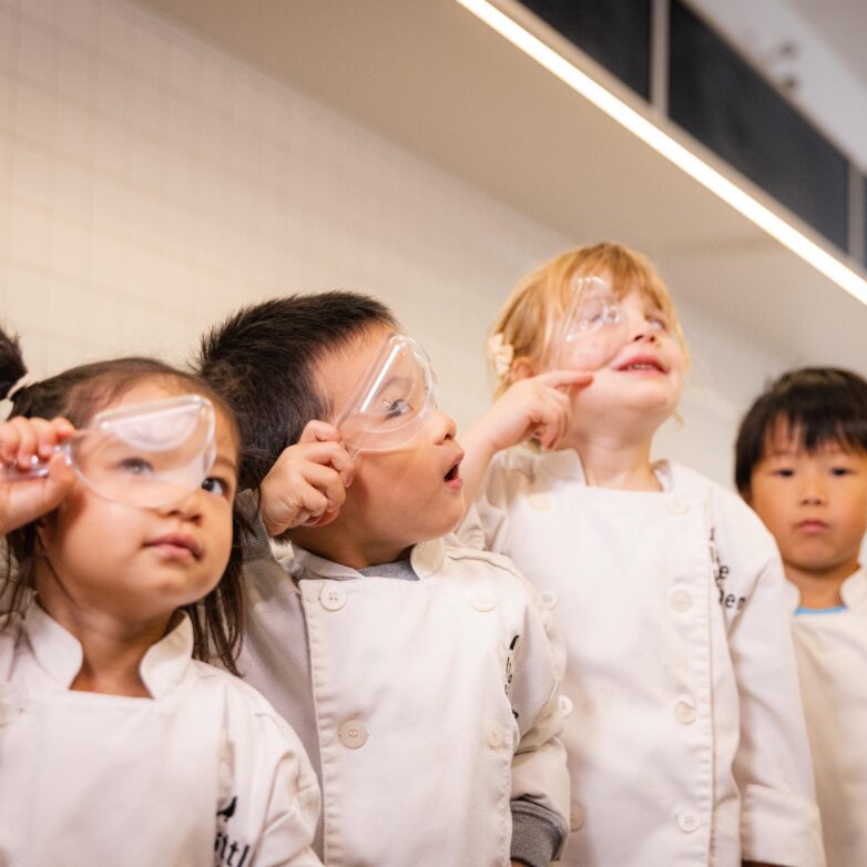 Students looking through measuring cups
