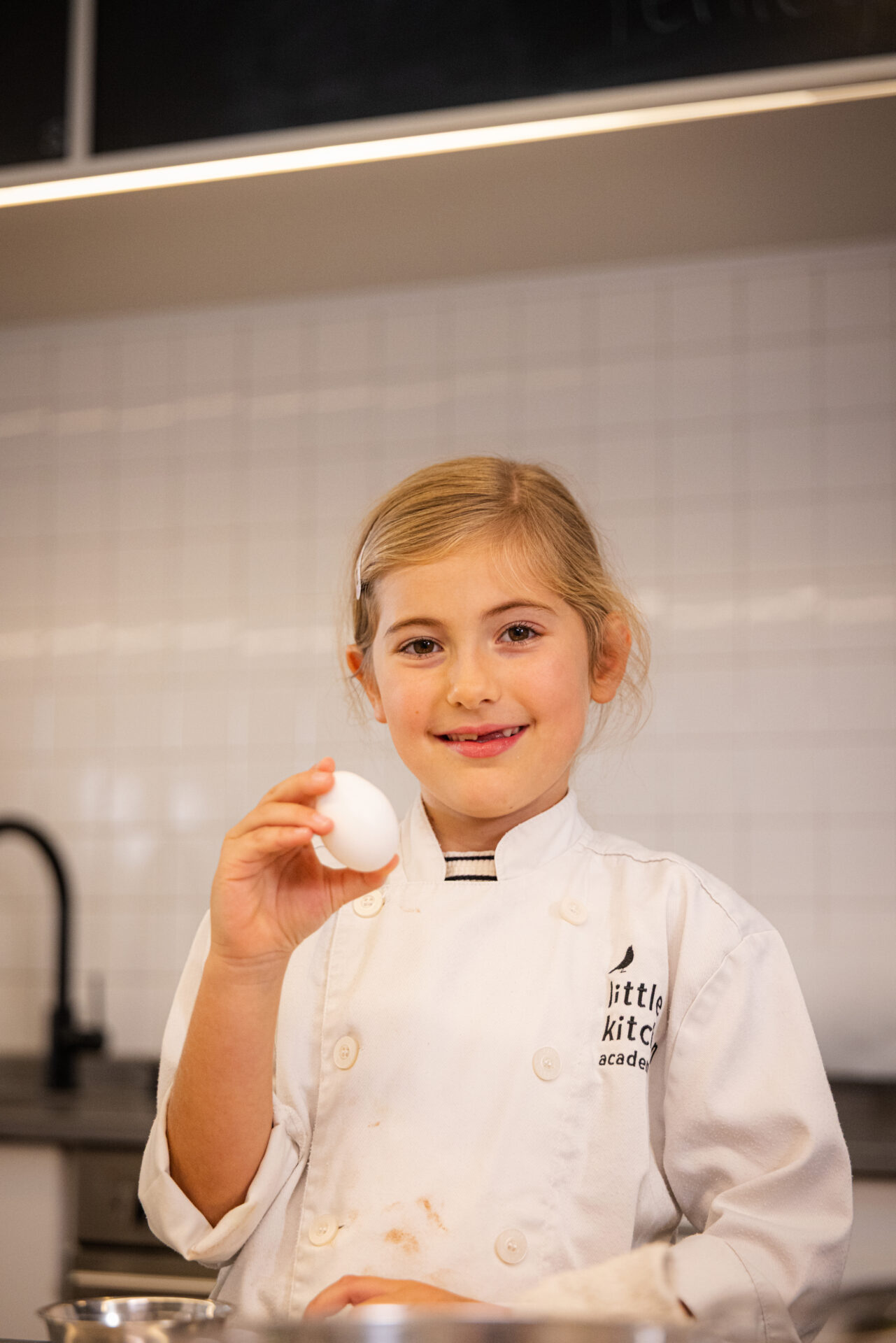 LKA Student Holding an Egg